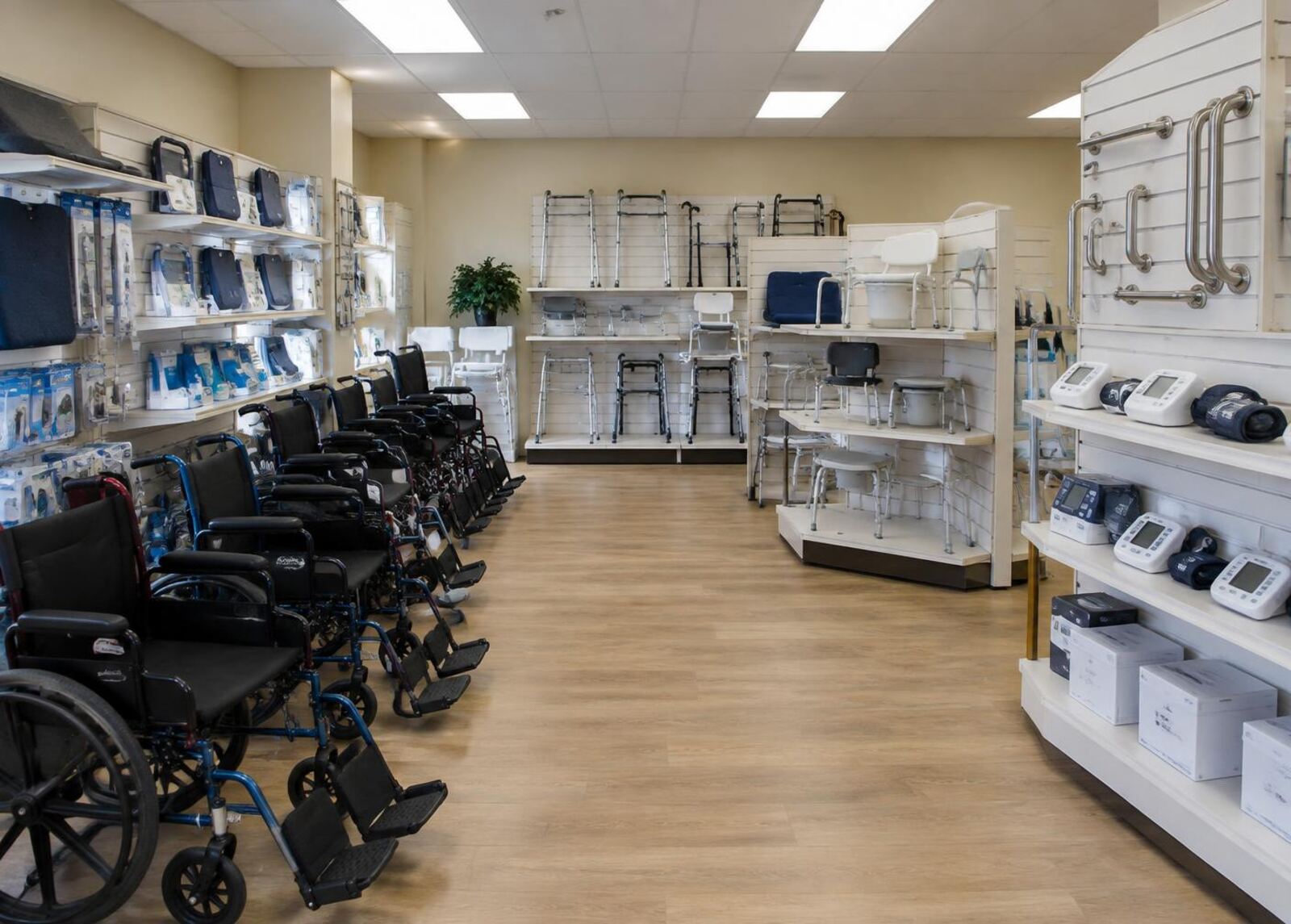 Wheelchairs, walkers and bathroom safety equipment on shelves in the showroom